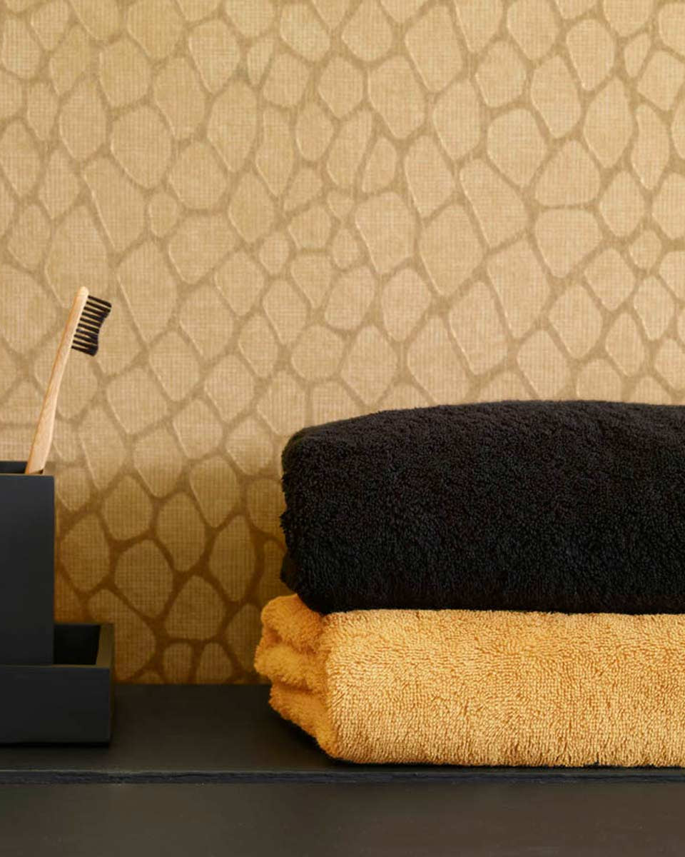 Asciugamani neri e ocra in abbinamento