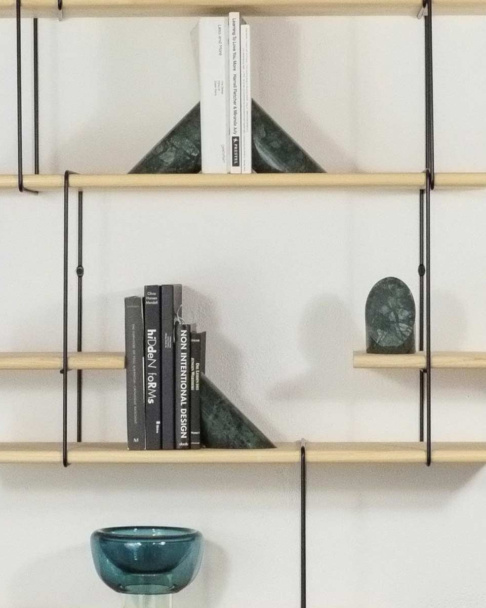 Fermalibri design in marmo verde